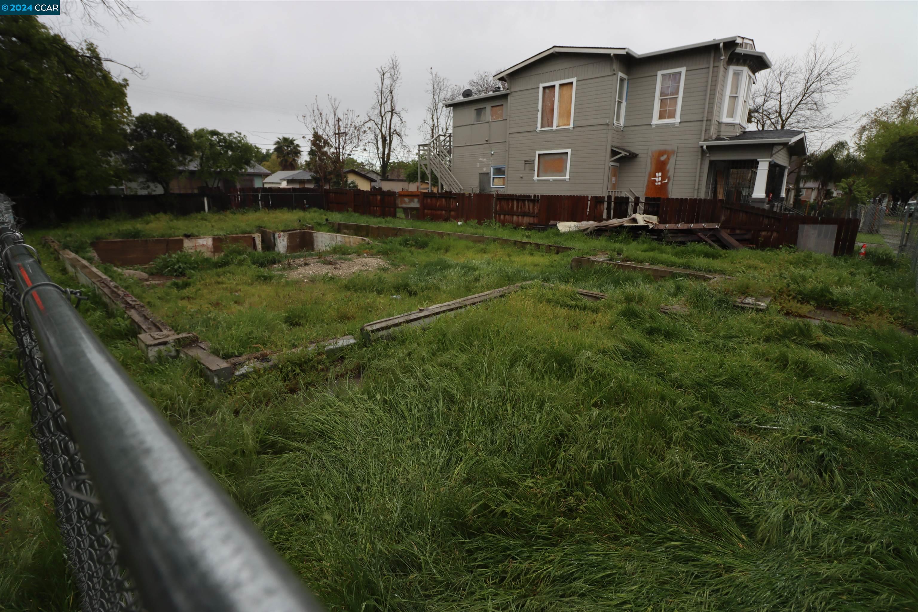 1602 South Sutter Street Stockton, CA 95206 - Photo 9 of 12 a view of a house with a yard