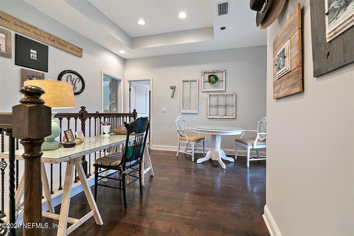 40 Pelican Pointe Road Ponte Vedra, FL 32081 - Photo 18 of 45 a view of a dining room with furniture and wooden floor
