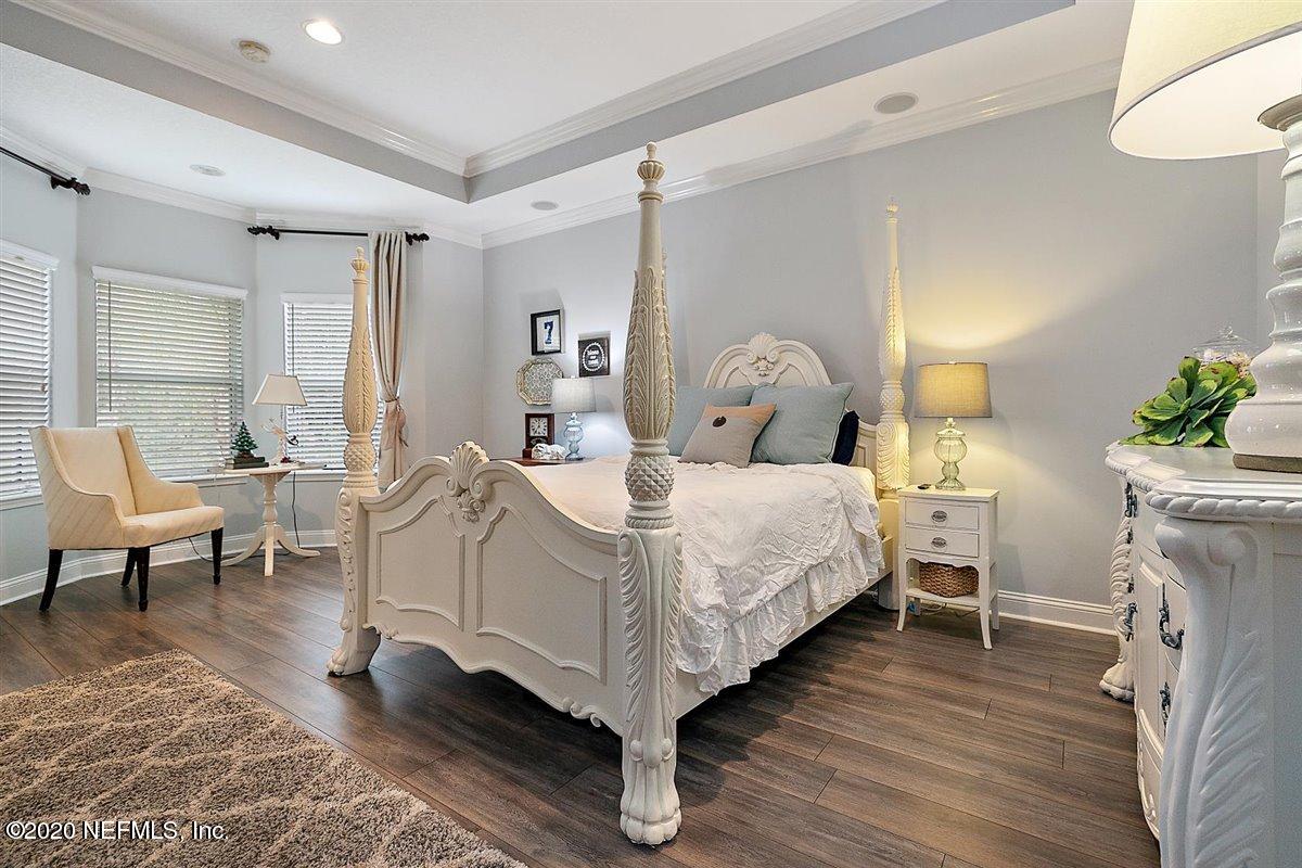 40 Pelican Pointe Road Ponte Vedra, FL 32081 - Photo 20 of 45 a bed room with a bed and a chair