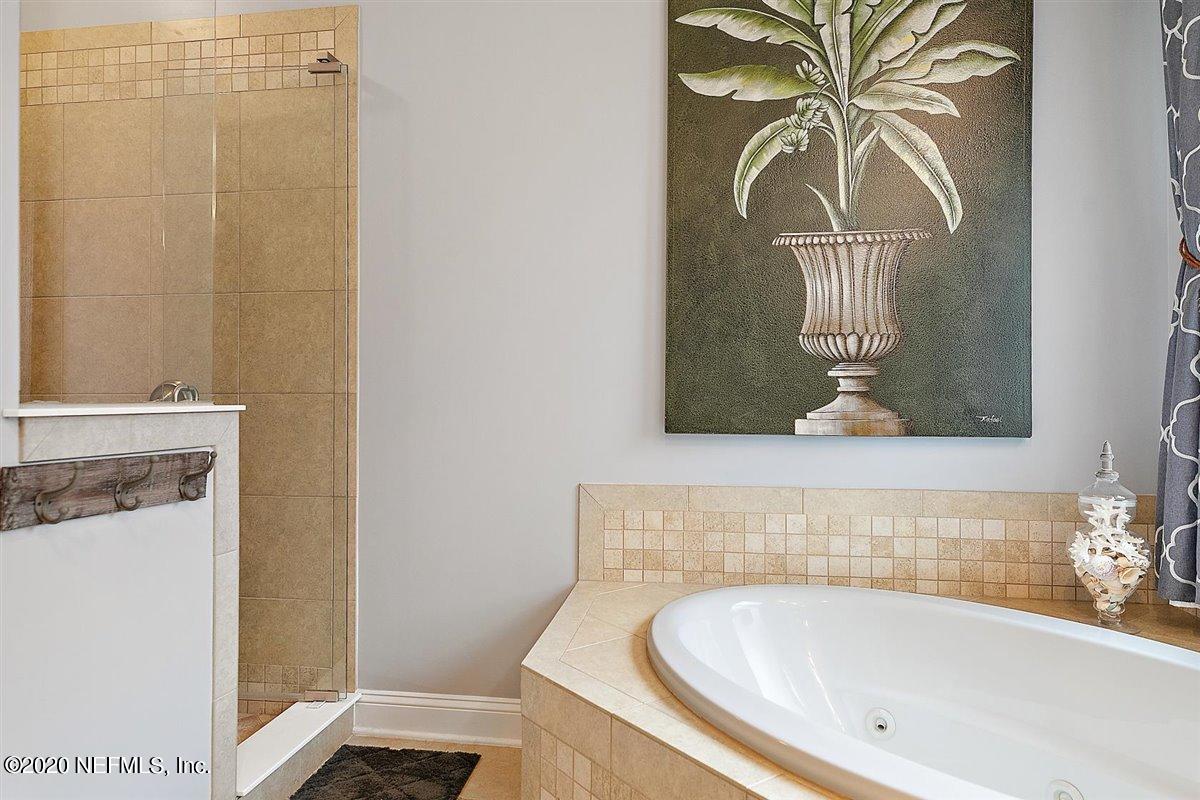 40 Pelican Pointe Road Ponte Vedra, FL 32081 - Photo 23 of 45 a bathroom with a tub and a shower