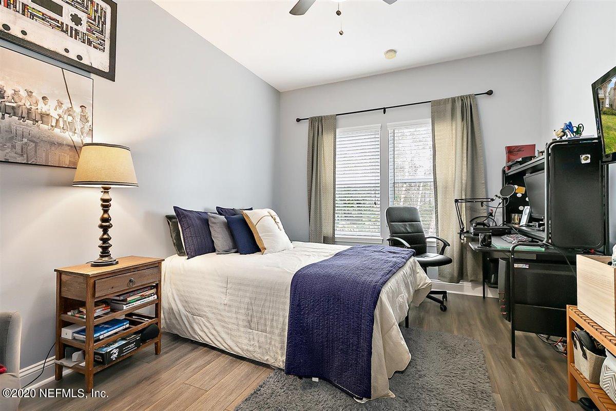 40 Pelican Pointe Road Ponte Vedra, FL 32081 - Photo 25 of 45 a bedroom with a bed and a flat tv screen on the dresser