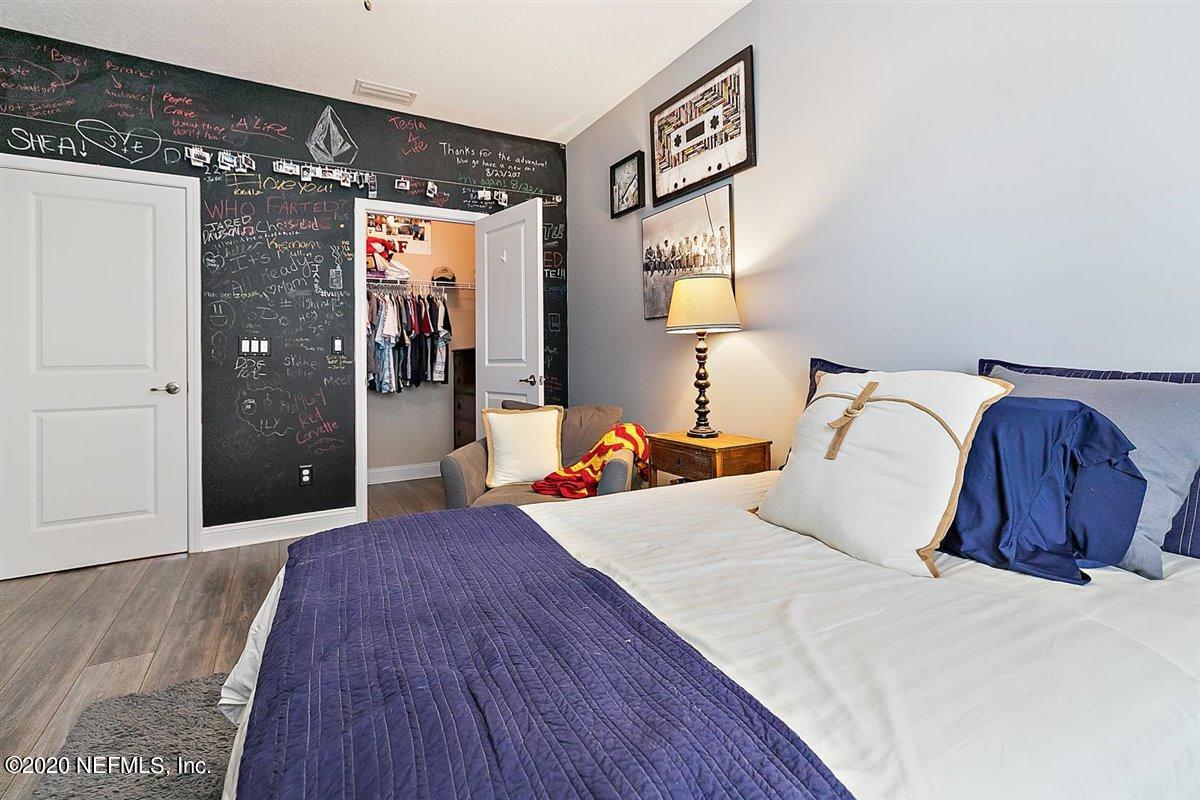 40 Pelican Pointe Road Ponte Vedra, FL 32081 - Photo 26 of 45 a bedroom with a bed and a large mirror on the dresser