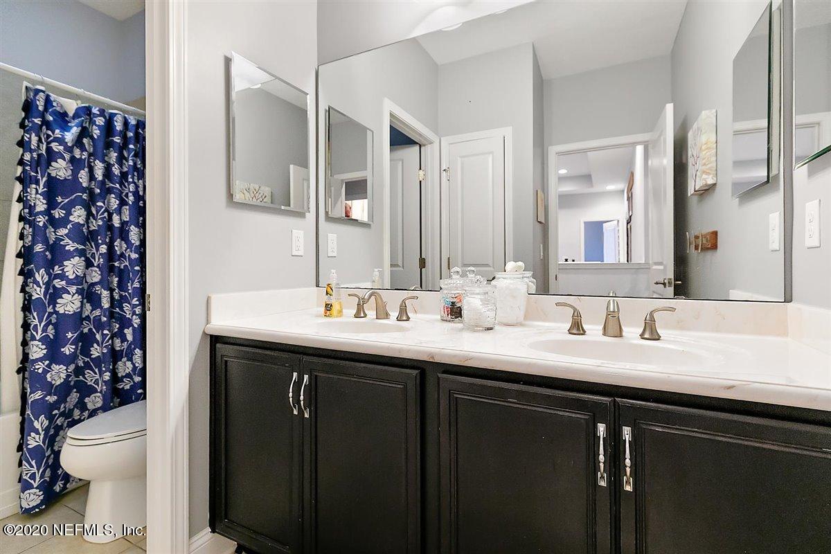 40 Pelican Pointe Road Ponte Vedra, FL 32081 - Photo 27 of 45 a bathroom with a double vanity sink toilet and a mirror