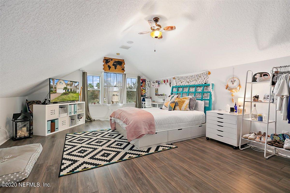 40 Pelican Pointe Road Ponte Vedra, FL 32081 - Photo 28 of 45 a bedroom with furniture and a wooden floor