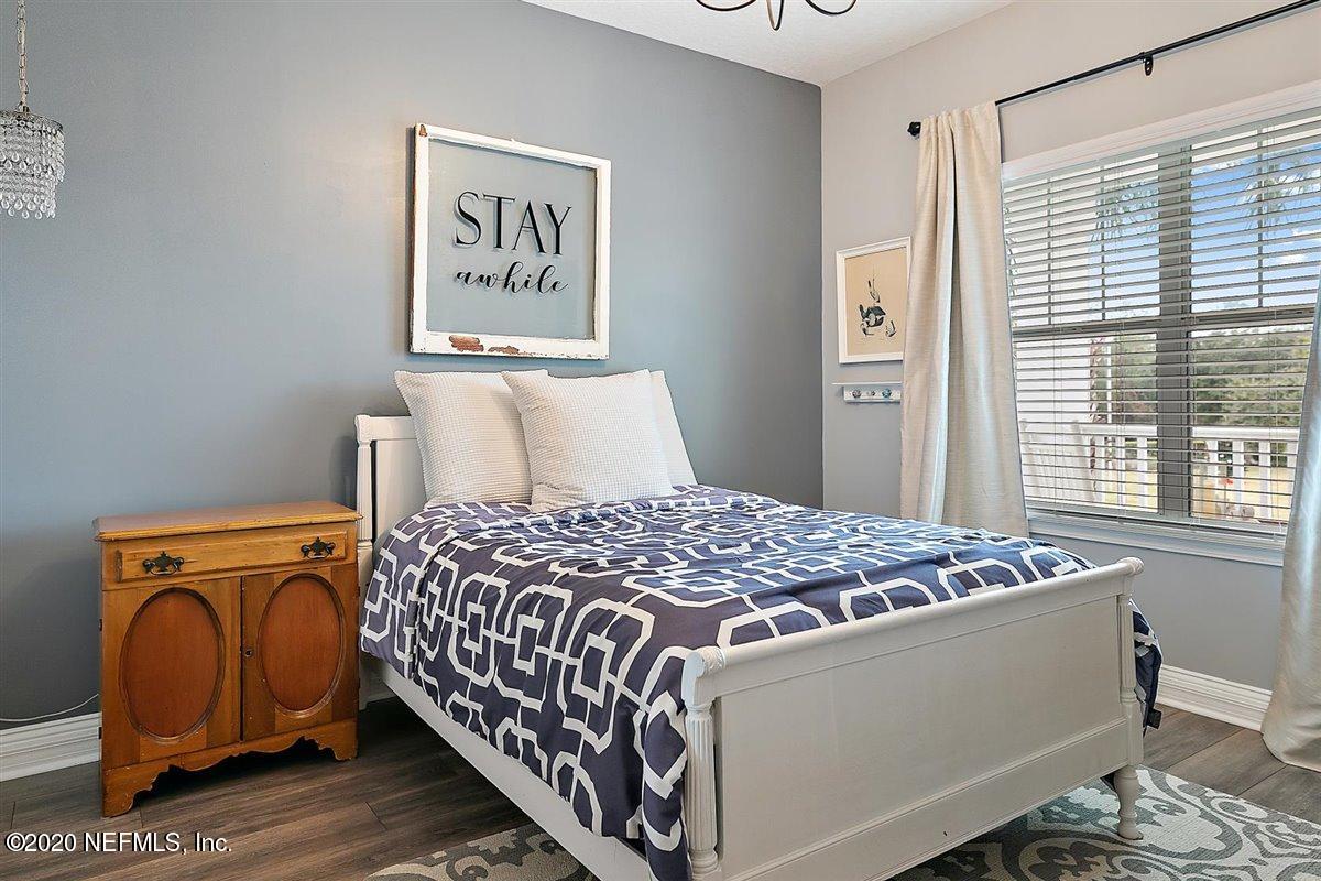 40 Pelican Pointe Road Ponte Vedra, FL 32081 - Photo 29 of 45 a bedroom with a bed and wooden floor