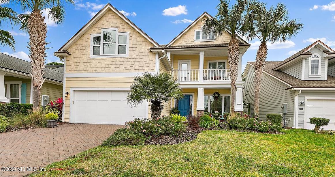 40 Pelican Pointe Road Ponte Vedra, FL 32081 - Photo 3 of 45 a front view of a house with a yard and potted plants