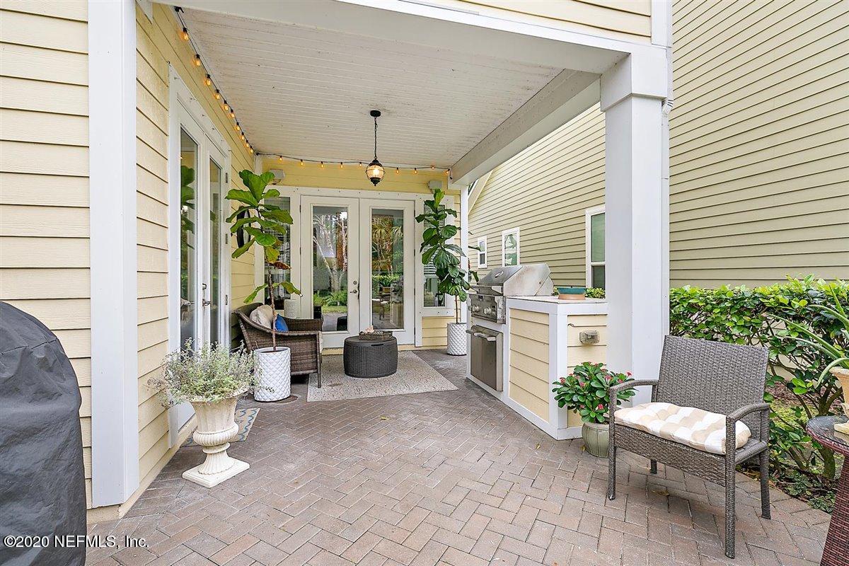 40 Pelican Pointe Road Ponte Vedra, FL 32081 - Photo 6 of 45 a view of a porch with chairs and potted plants