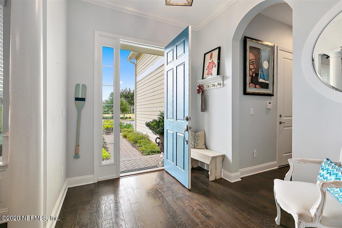 40 Pelican Pointe Road Ponte Vedra, FL 32081 - Photo 7 of 45 a view of a hallway with wooden floor and a livingroom