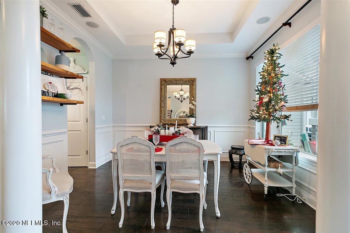 40 Pelican Pointe Road Ponte Vedra, FL 32081 - Photo 8 of 45 a view of a dining room with furniture and chandelier