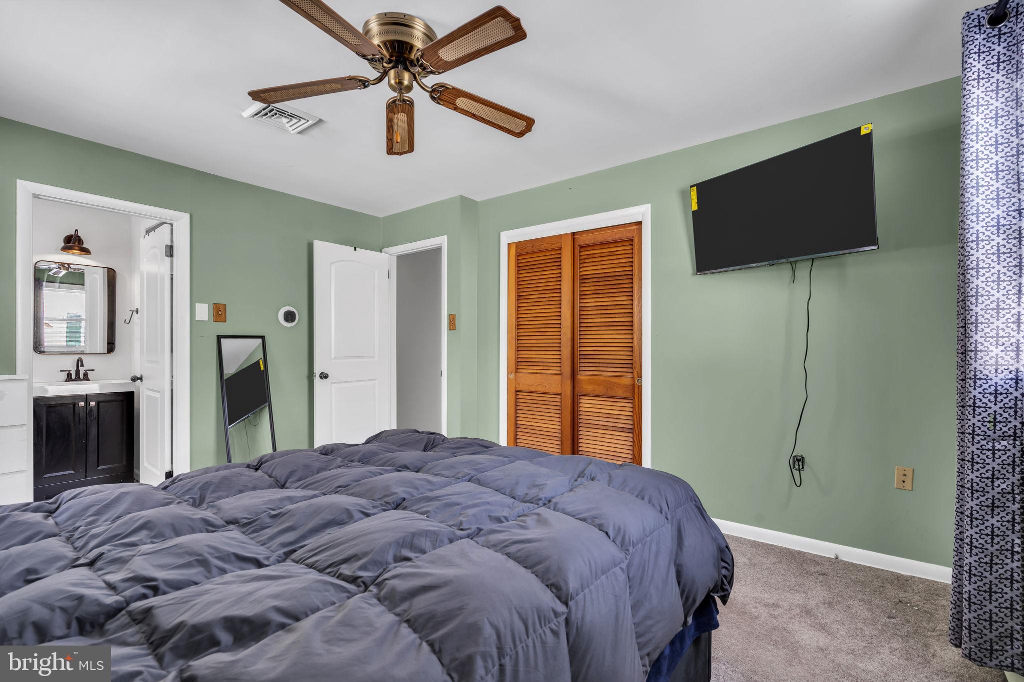 46 Sunset Avenue Hamilton, NJ 08610 - Photo 20 of 28 a bedroom with a bed and a flat screen tv