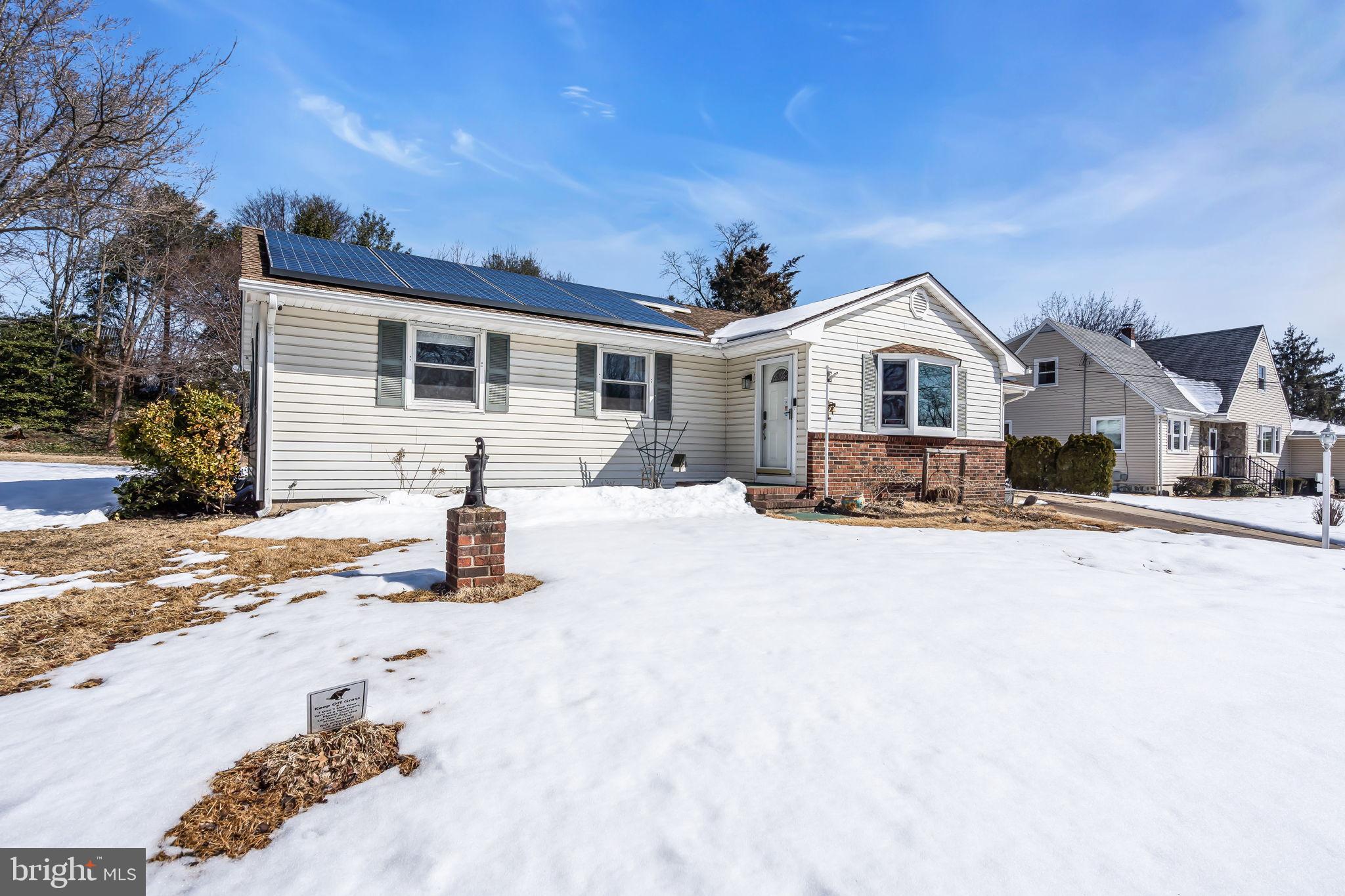 46 Sunset Avenue Hamilton, NJ 08610 - Photo 2 of 28 a front view of a house with a yard covered in snow