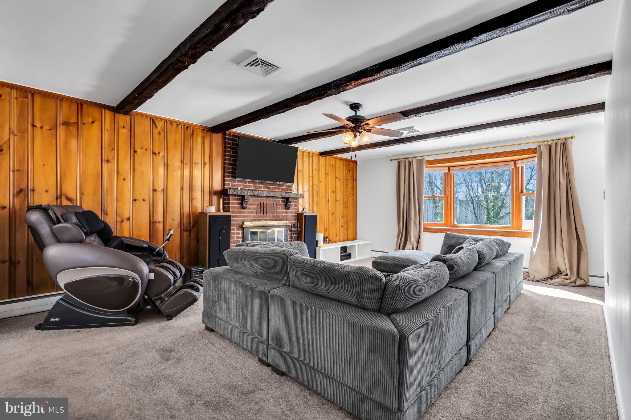 46 Sunset Avenue Hamilton, NJ 08610 - Photo 6 of 28 a living room with furniture a large window and chandelier