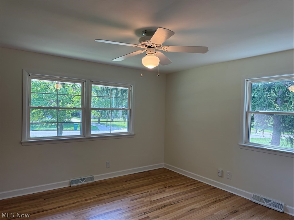 475 Meadowlane Road Seven Hills, OH 44131 - Photo 16 of 38 Bedroom with 2 windows and hardwood floors