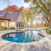 a view of a swimming pool with an outdoor seating