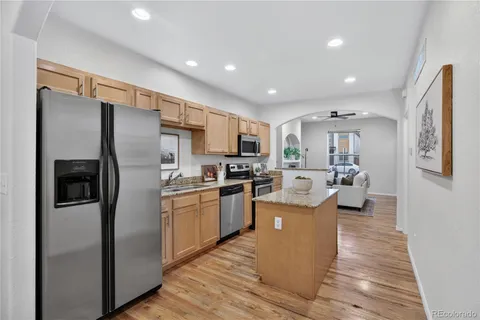 a kitchen view with stainless steel appliances lots of counter top space