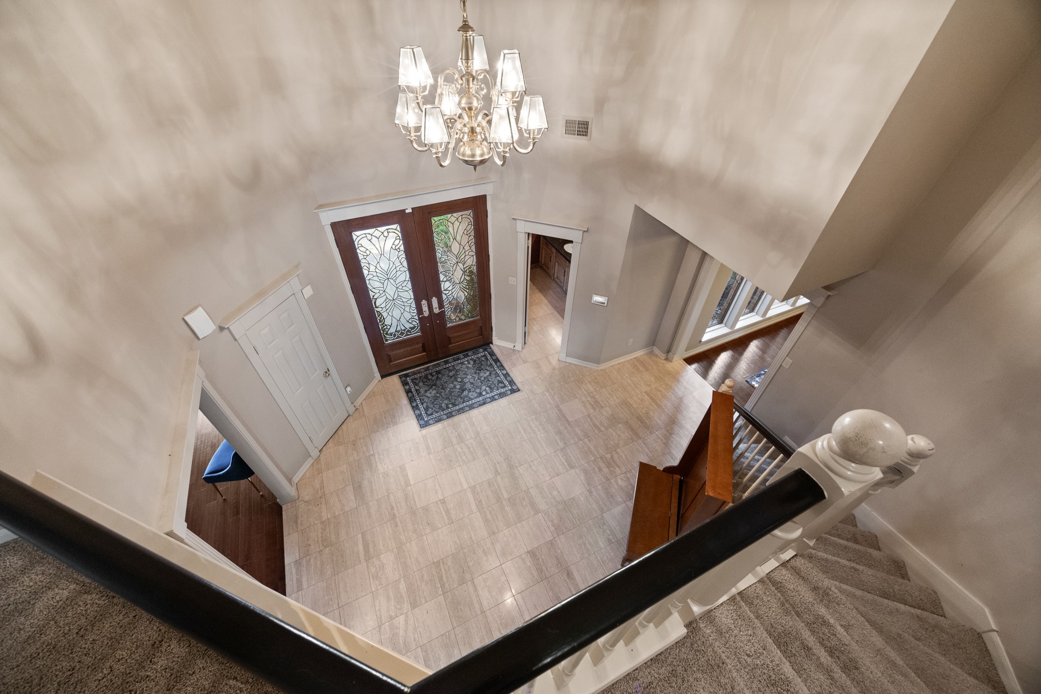 8807 Chelmsford Lane Spring, TX 77379 - Photo 31 of 50 A view of the impressive entry from the top of the stairs.