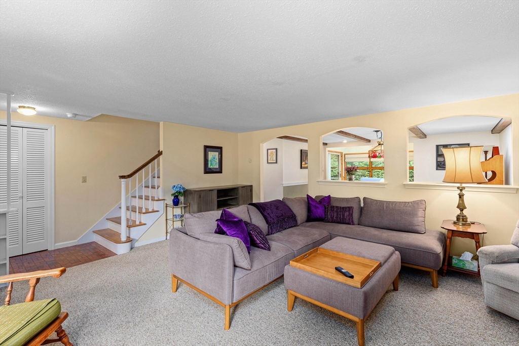 140 Rolling Hitch Road Barnstable, MA 02632 - Photo 14 of 36 a living room with furniture and a wooden floor