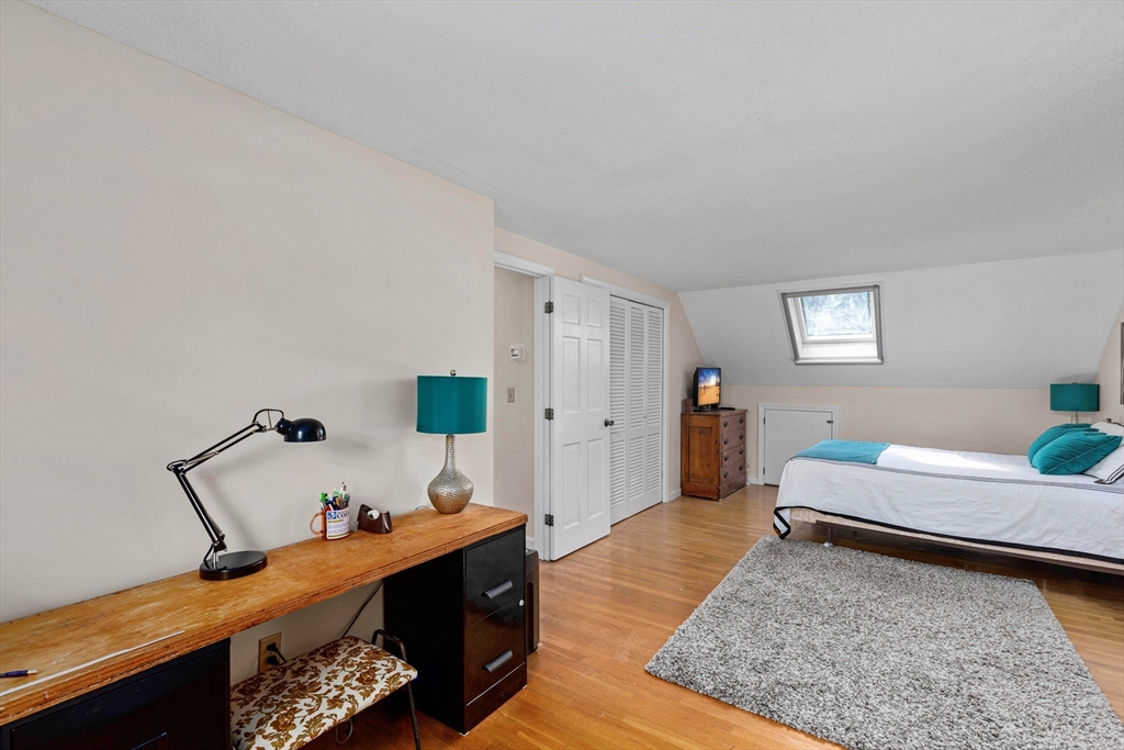 140 Rolling Hitch Road Barnstable, MA 02632 - Photo 28 of 36 a bedroom with furniture and a wooden floor