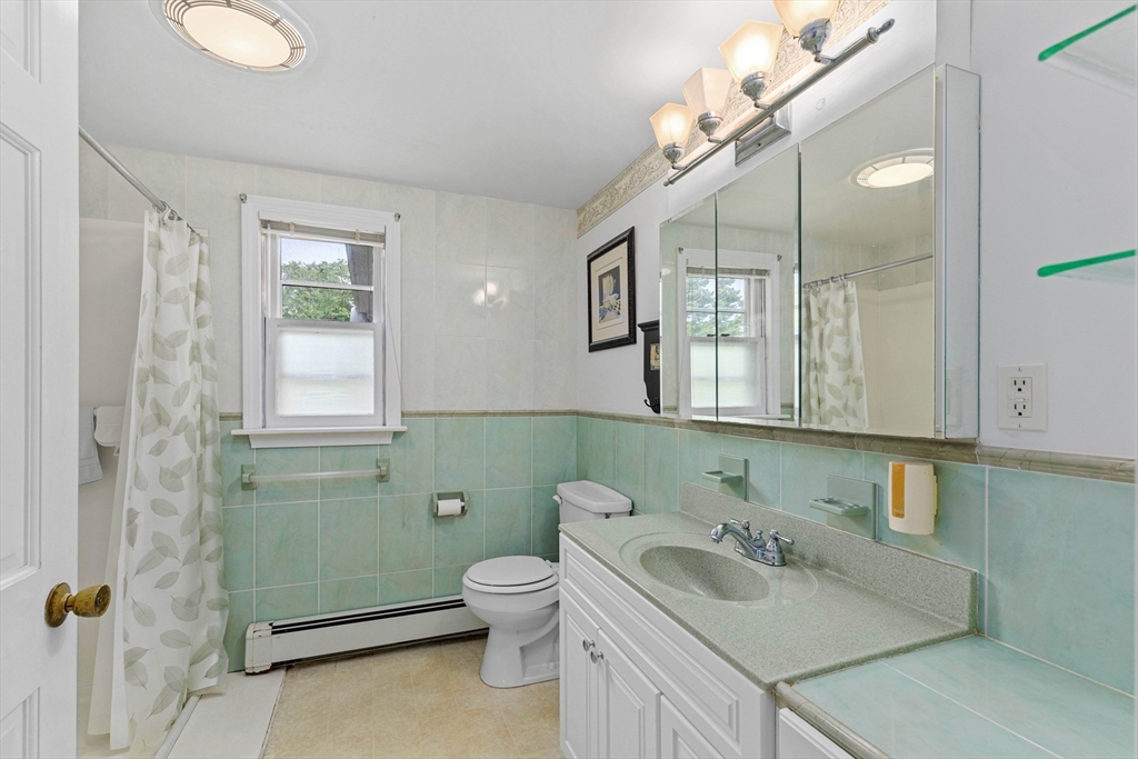 140 Rolling Hitch Road Barnstable, MA 02632 - Photo 30 of 36 a bathroom with a sink toilet and mirror