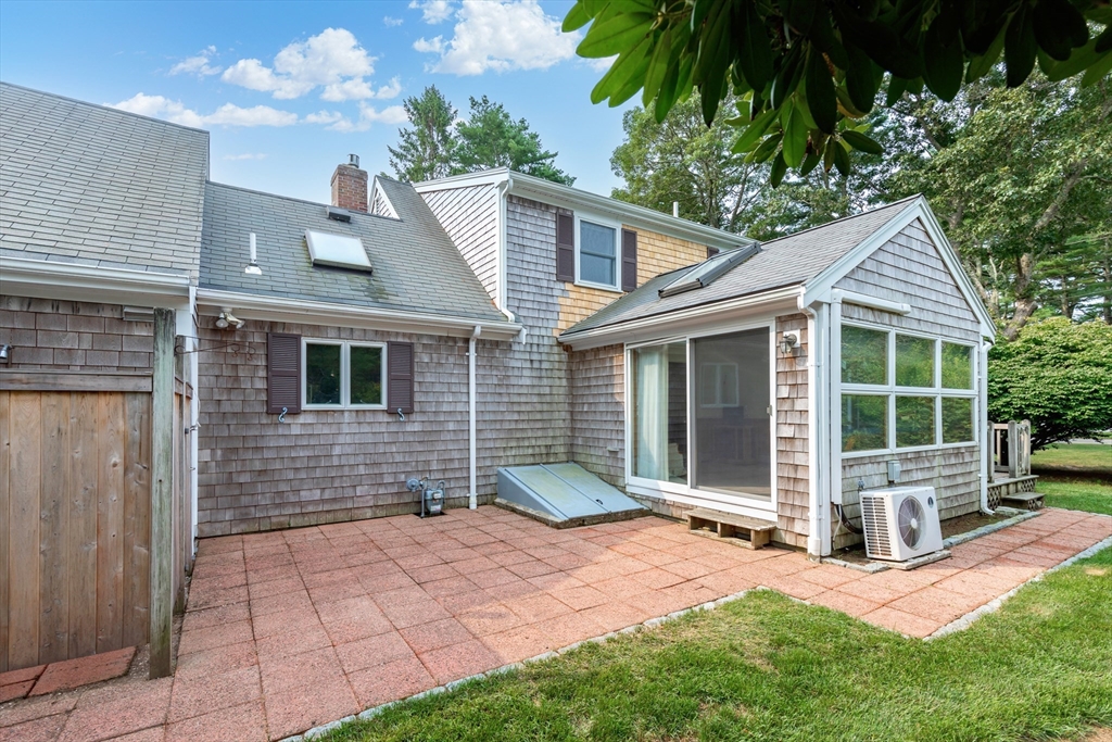 140 Rolling Hitch Road Barnstable, MA 02632 - Photo 3 of 36 a front view of a house with garden