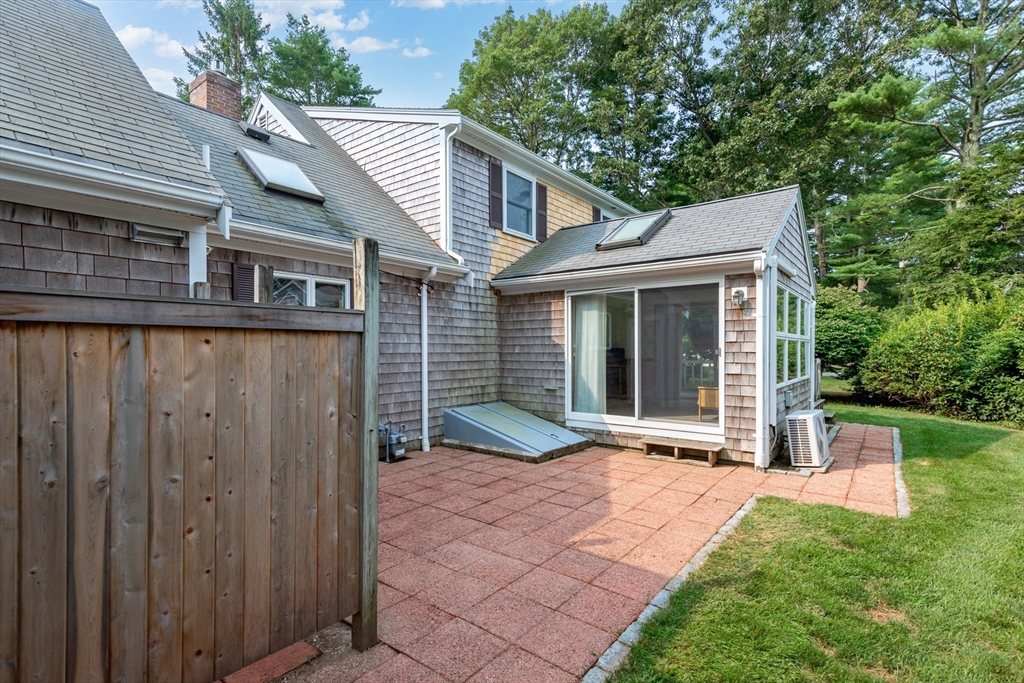 140 Rolling Hitch Road Barnstable, MA 02632 - Photo 32 of 36 a view of a house with backyard