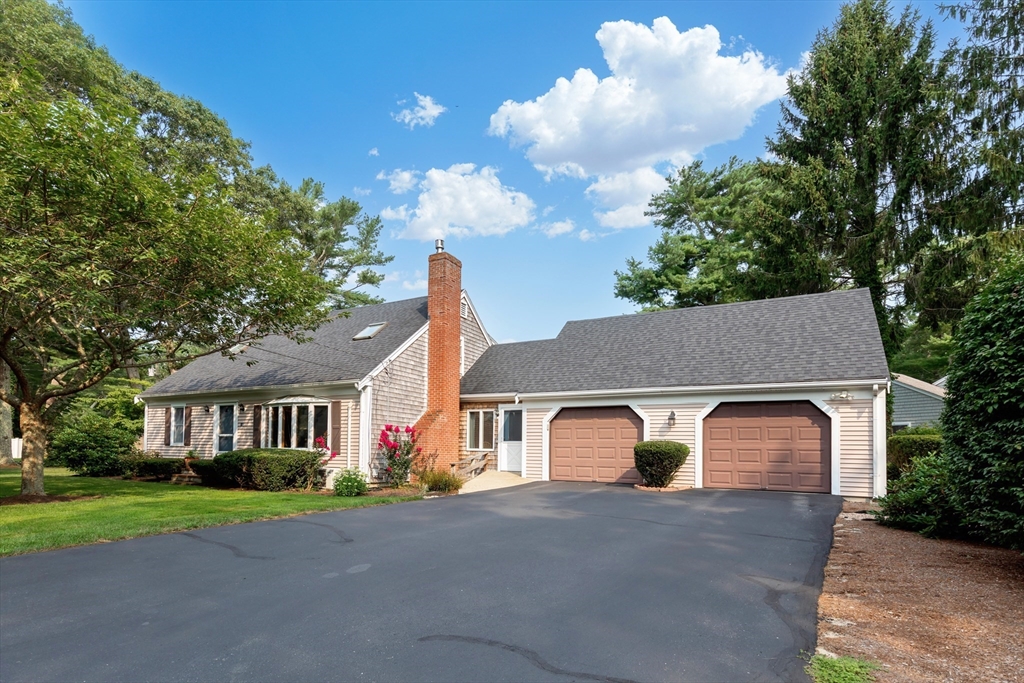140 Rolling Hitch Road Barnstable, MA 02632 - Photo 33 of 36 a front view of a house with garden