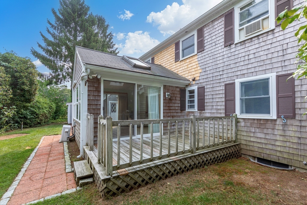 140 Rolling Hitch Road Barnstable, MA 02632 - Photo 4 of 36 a view of a house with a yard
