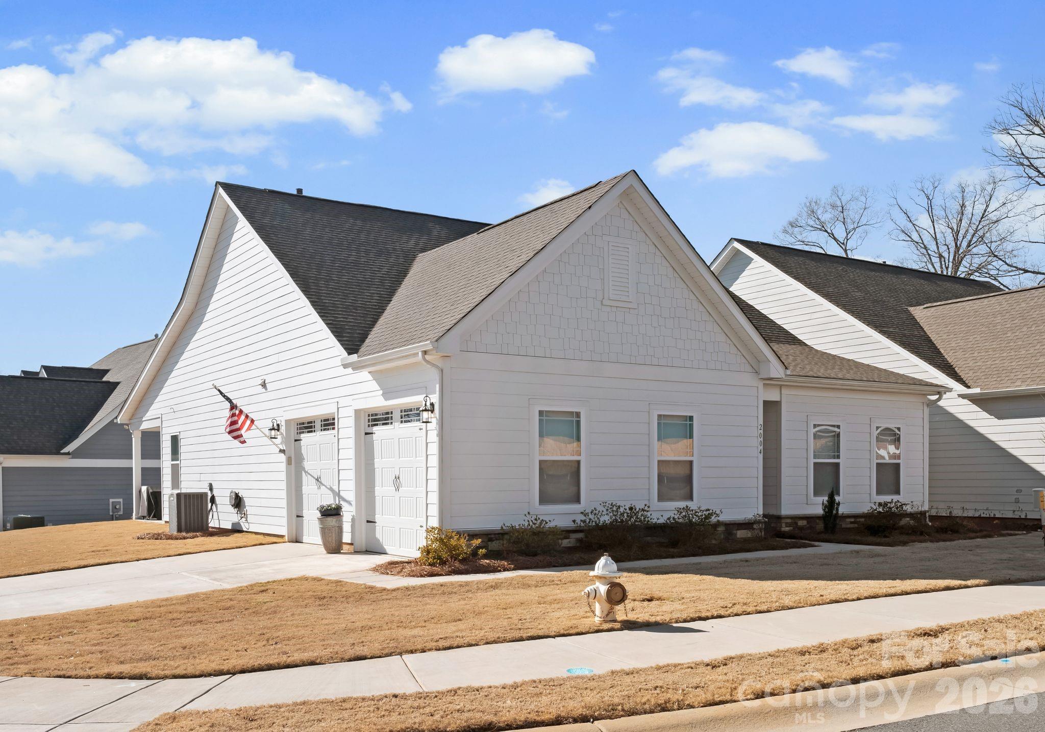 a view of a house with snow on the road