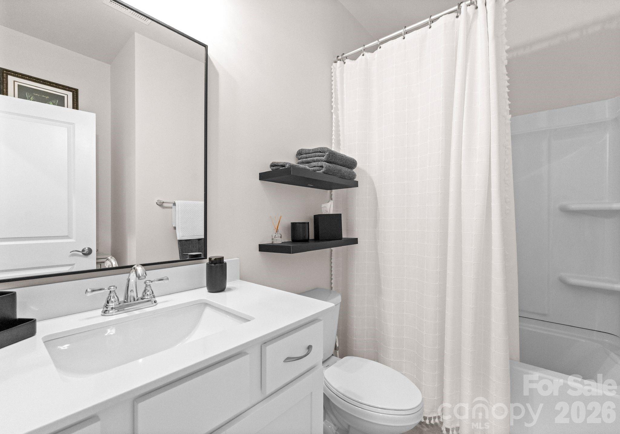 2004 Bonds Lane Fort Mill, SC 29715 - Photo 25 of 41 a bathroom with a sink toilet and vanity