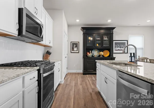 a kitchen with a stove and a sink