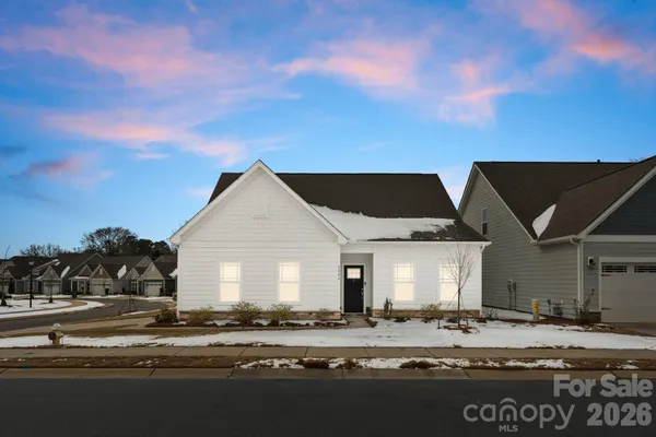 a view of large house with a yard