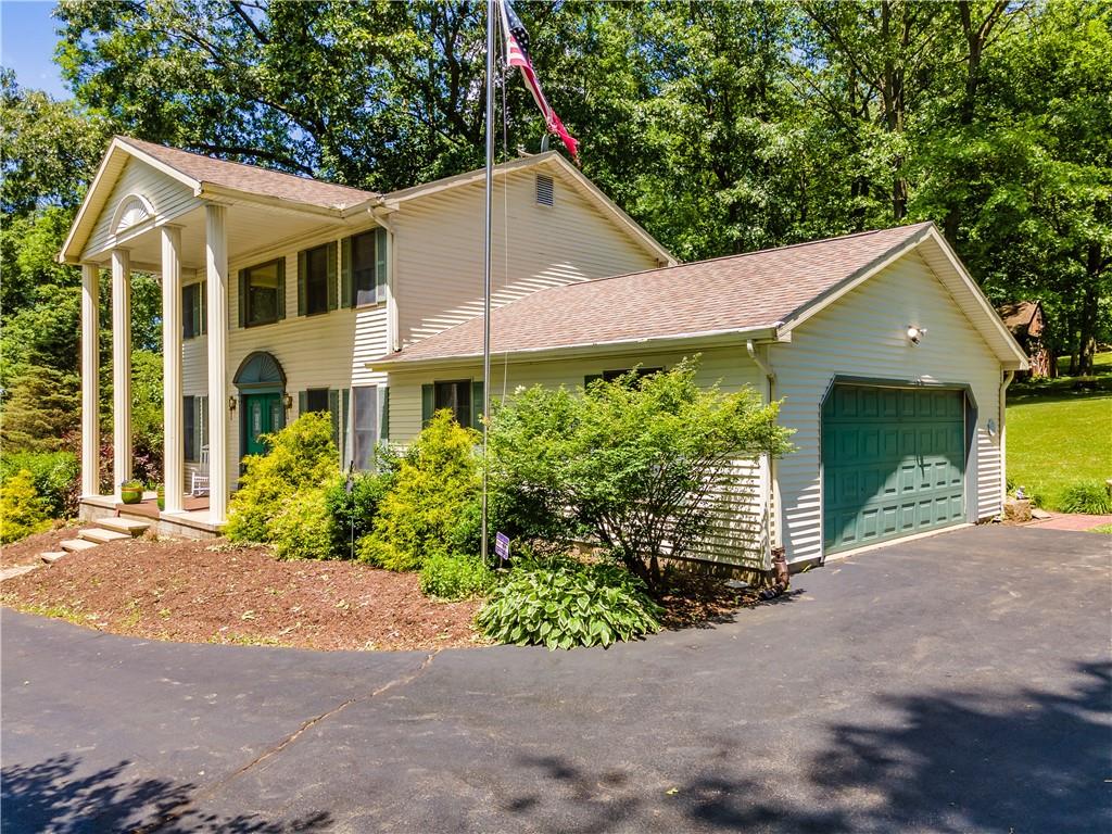 188 Hopper Road Transfer, PA 16154 - Photo 3 of 25 a front view of a house with a yard and potted plants