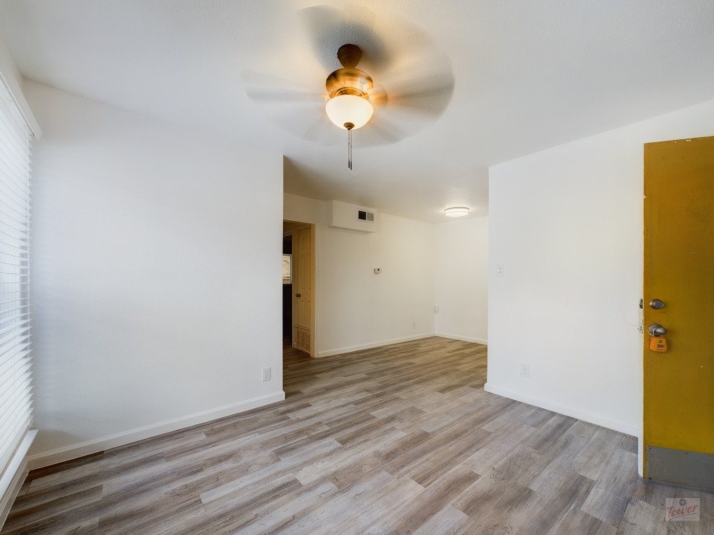 2401 Manor Road, Unit 137 Austin, TX 78722 - Photo 3 of 15 a view of a livingroom with wooden floor