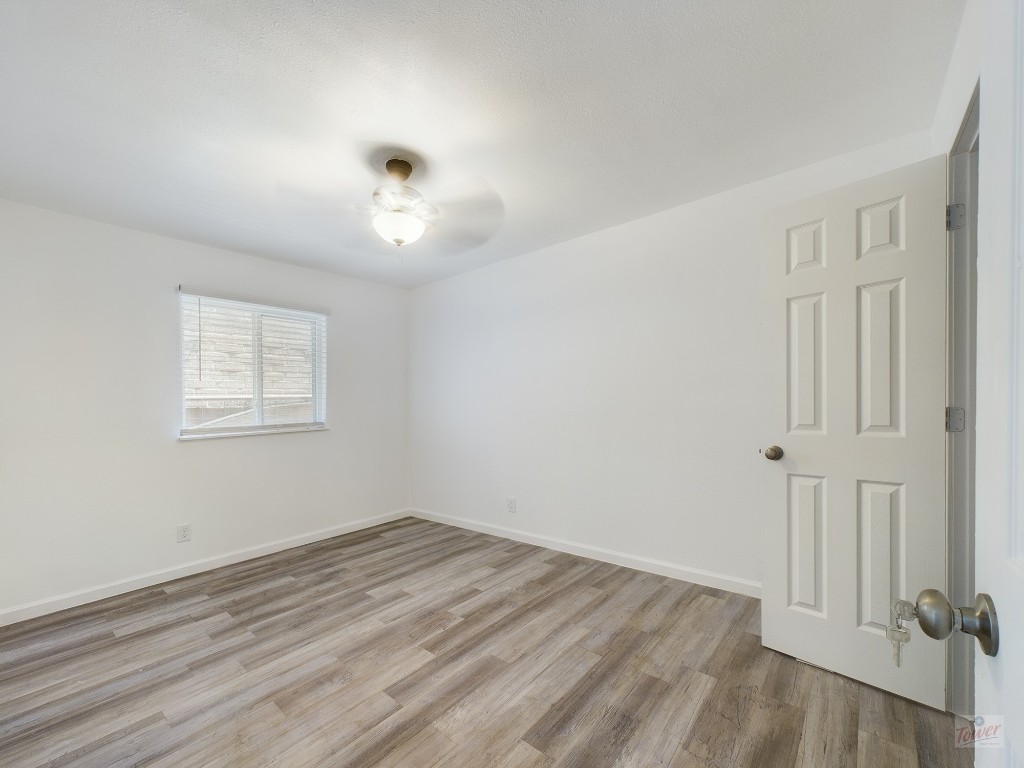 2401 Manor Road, Unit 137 Austin, TX 78722 - Photo 7 of 15 wooden floor in an empty room