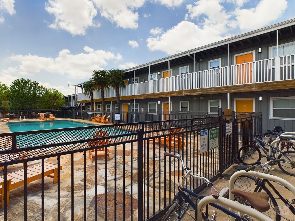 2401 Manor Road, Unit 137 Austin, TX 78722 - Photo 10 of 15 a view of a house with a deck and a large window