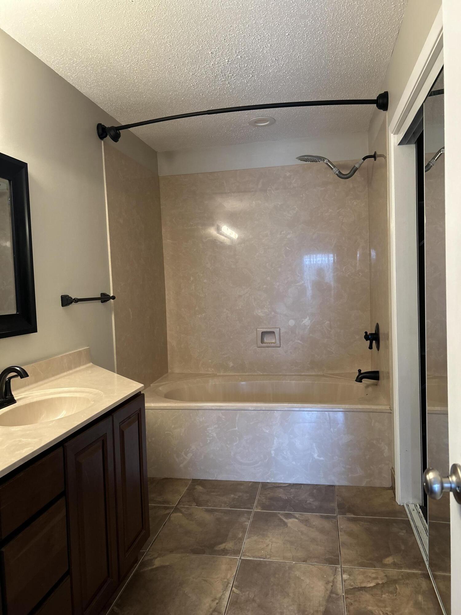 404 Adam Street Northwest Fort Walton Beach, FL 32548 - Photo 7 of 11 a bathroom with a sink and shower