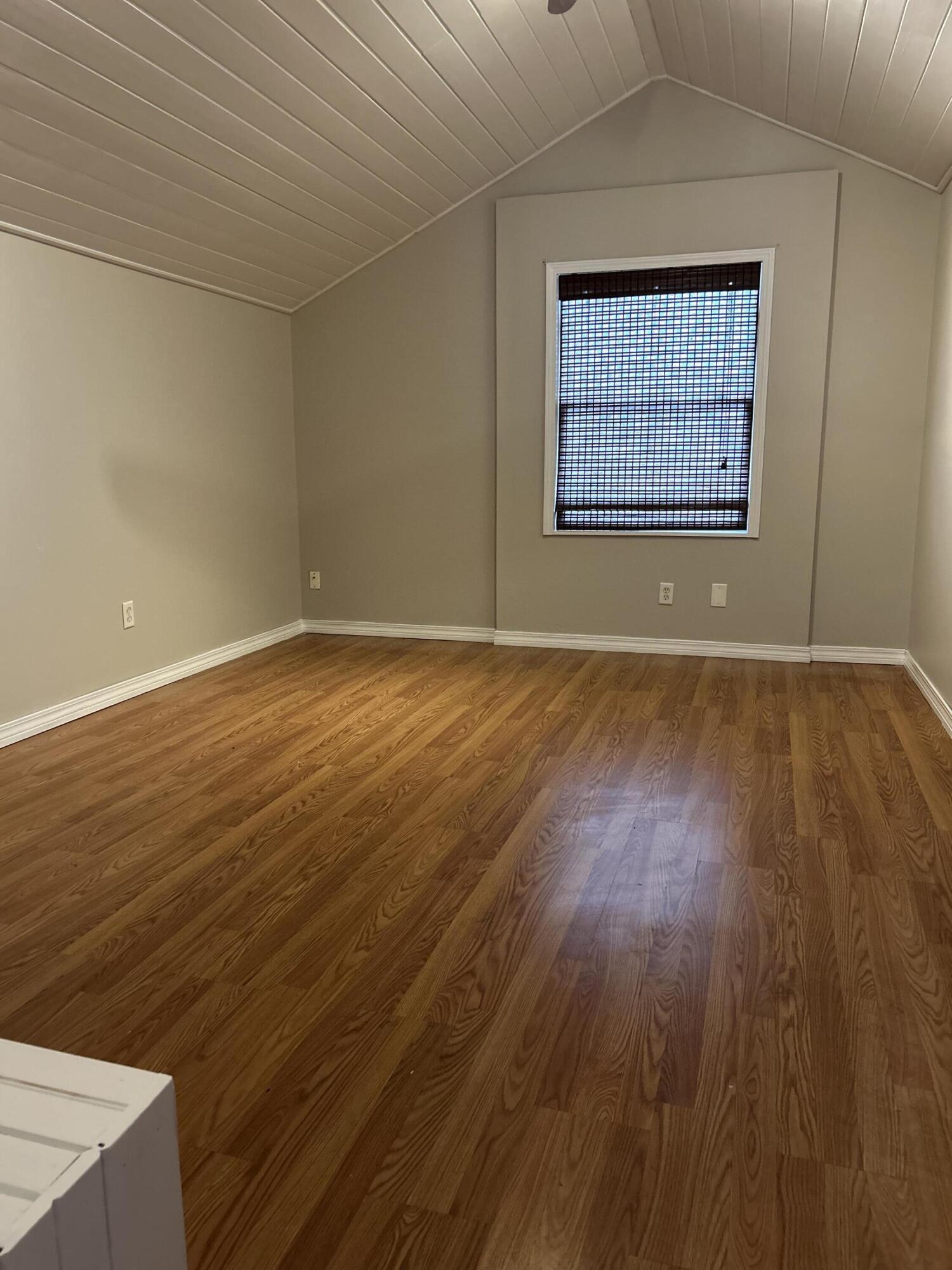 404 Adam Street Northwest Fort Walton Beach, FL 32548 - Photo 8 of 11 an empty room with wooden floor and windows
