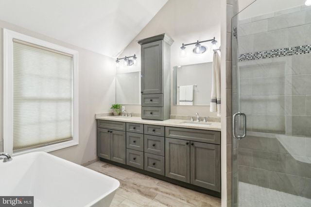 a view of work space with wooden floor and furniture