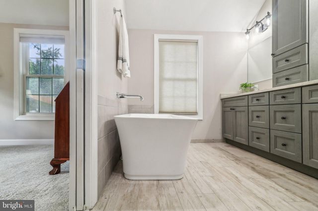 a picture of a room with a white wall and sign