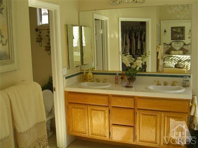 11176 Terraceridge Road Moorpark, CA 93021 - Photo 11 of 13 a bathroom with a granite countertop sink and a mirror