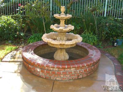 11176 Terraceridge Road Moorpark, CA 93021 - Photo 12 of 13 a view of a water fountain in the middle of a garden
