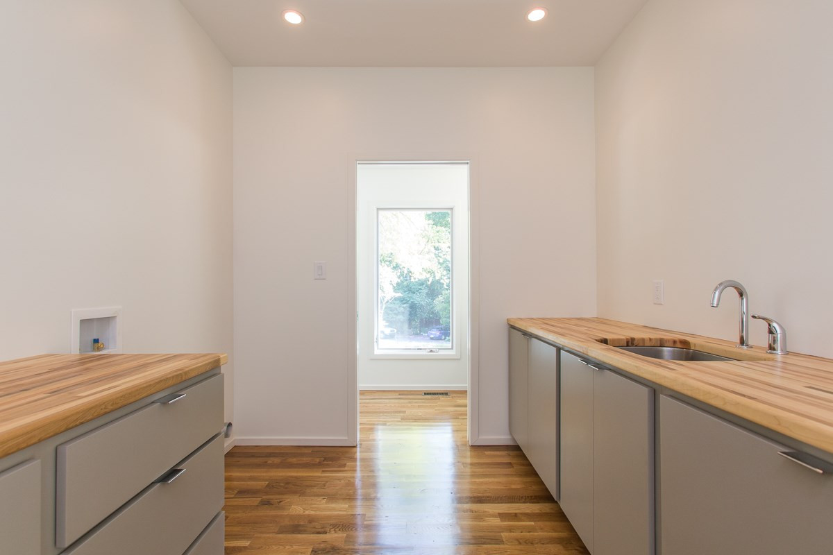 3902 Darby Road Durham, NC 27707 - Photo 21 of 25 Large Bright Laundry Room with Rich Wood Custom Counter Tops