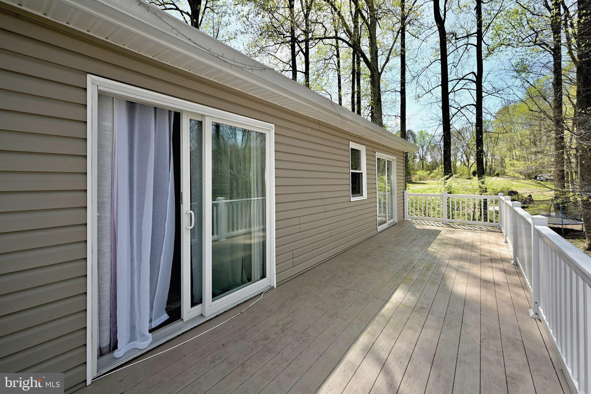 651 Walton Road Huntingtown, MD 20639 - Photo 43 of 58 A long patio off of upper-level bedroom