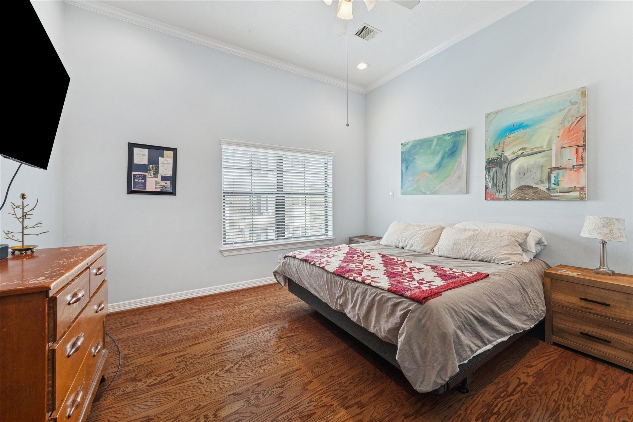 3203 Garden Oaks View Houston, TX 77018 - Photo 7 of 13 a bedroom with a bed and a flat screen tv