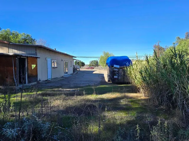 a view of livingroom and hallway with wooden floor