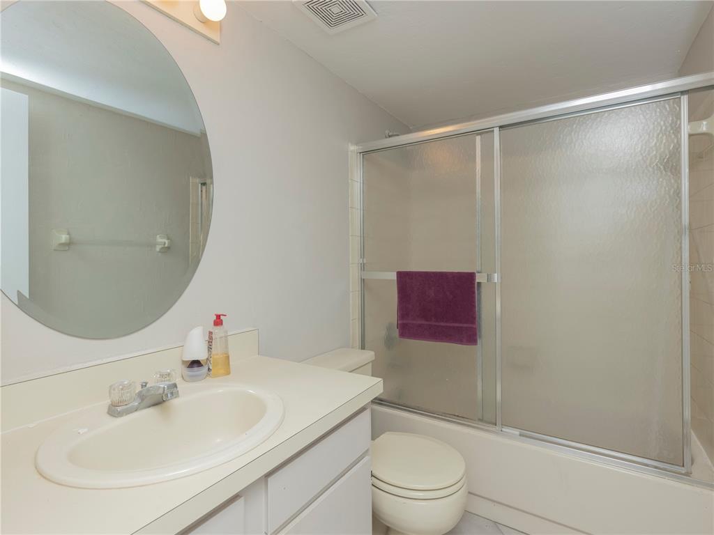 4356 Southwest 20th Lane Gainesville, FL 32607 - Photo 9 of 15 a bathroom with a sink and a mirror