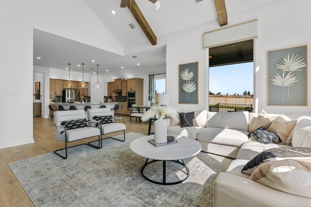 20400 Stelfox Street Manor, TX 78653 - Photo 17 of 37 Living area featuring recessed lighting, light wood-type flooring, high vaulted ceiling, a ceiling fan, and beamed ceiling