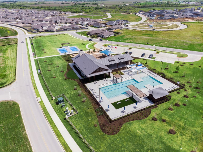 20400 Stelfox Street Manor, TX 78653 - Photo 28 of 37 Aerial view of residential area with a pool