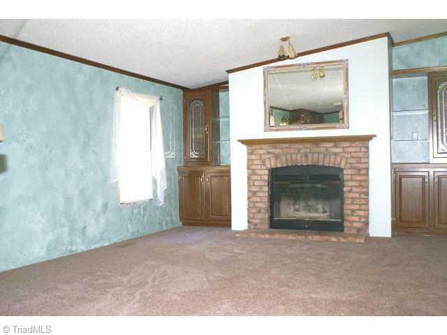 168 Smothers Road Madison, NC 27025 - Photo 4 of 9 Other. Den with wood burning fp.
