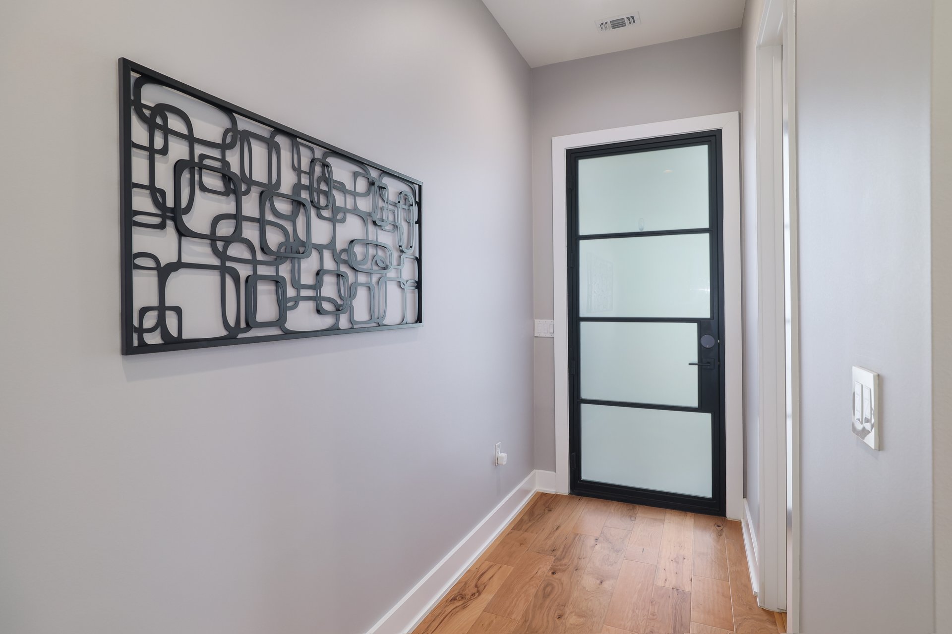 1103 Saucedo Street, Unit B Austin, TX 78721 - Photo 3 of 26 Stepping across the threshold, you’re immediately greeted by an inviting, sun-drenched foyer that hints at the open-concept layout waiting just inside